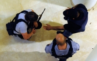 Security Personnel disarm a weapon