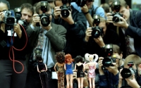 Press photographers crowd to take the first photographs of a new range of Spice Girls Dolls 1997