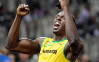 Usian Bolt celebrates after winning 100 m Olympic gold, 2012