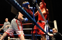 Men fighting in the ring