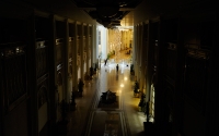 A member of the media stands in the atrium