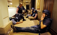 Members of the media wait