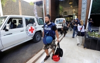 Cameraman Yohei Morimoto is evacuated
