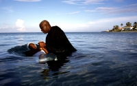 A woman is baptised