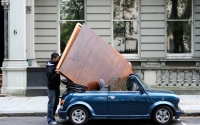 Men load a mini