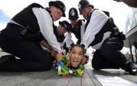 A protestor is detained, 2012