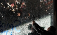 Demonstrators break windows of the Conservative Party headquarters