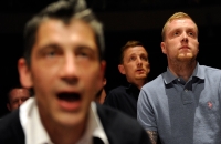 Men watch a friend box